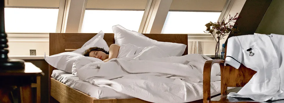 Woman asleep in loft conversion